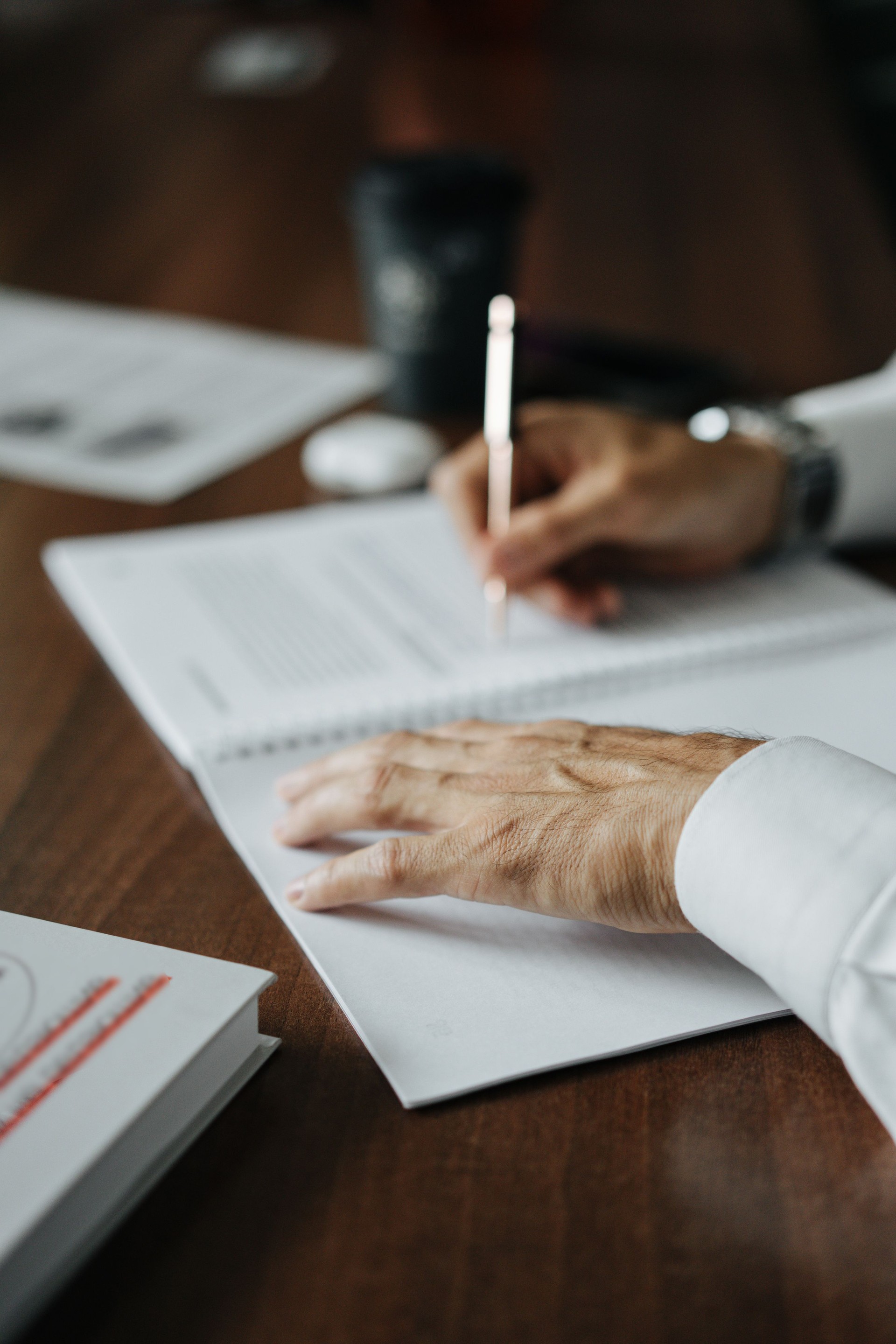 businessman's hands as he works with documents